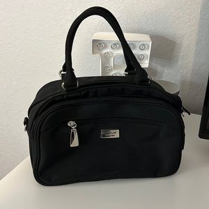 Black purse with individual card slots and phone holder. The filter New York